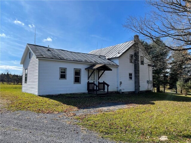 2192 State Route 8, Ohio, NY 13324 - view of home's exterior with metal roof and a yard