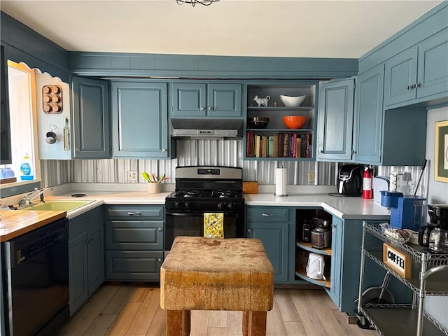 605 Watkins Rd, Horseheads, NY 14845 - kitchen with a sink, open shelves, light wood finished floors, under cabinet range hood, and black appliances