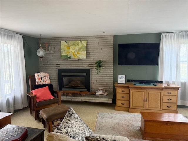 605 Watkins Rd, Horseheads, NY 14845 - living room featuring a brick fireplace and light colored carpet
