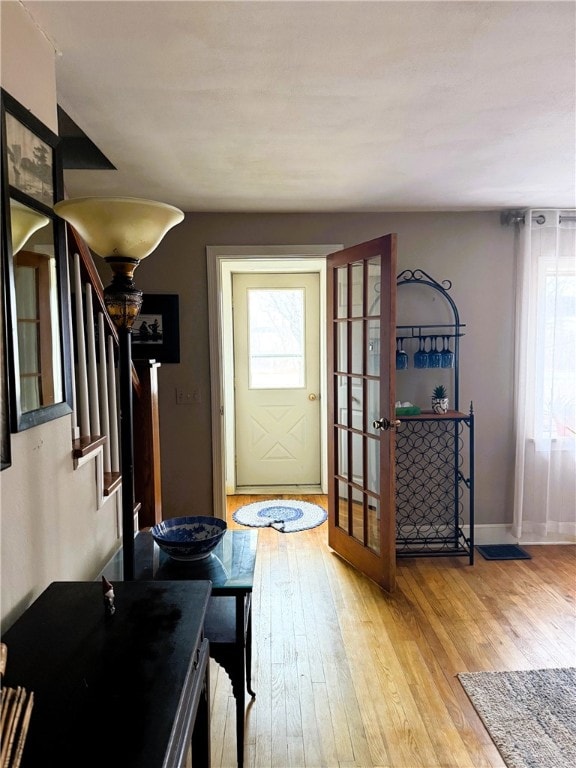 605 Watkins Rd, Horseheads, NY 14845 - foyer with baseboards, light wood-style flooring, and stairway