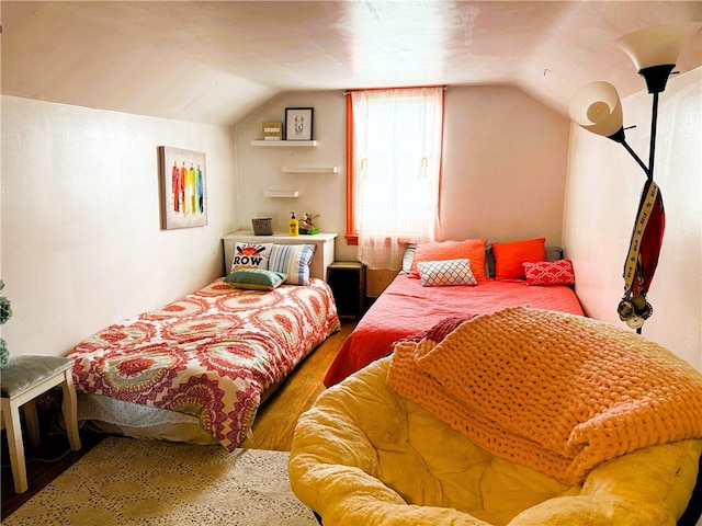 605 Watkins Rd, Horseheads, NY 14845 - bedroom featuring lofted ceiling and wood finished floors