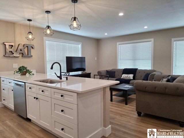 15 E Summit St, Busti, NY 14750 - kitchen featuring open floor plan, dishwasher, a sink, and light wood-style flooring