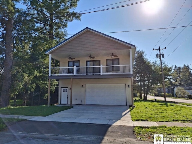15 E Summit St, Busti, NY 14750 - view of front facade featuring an attached garage, ceiling fan, a front lawn, and concrete driveway
