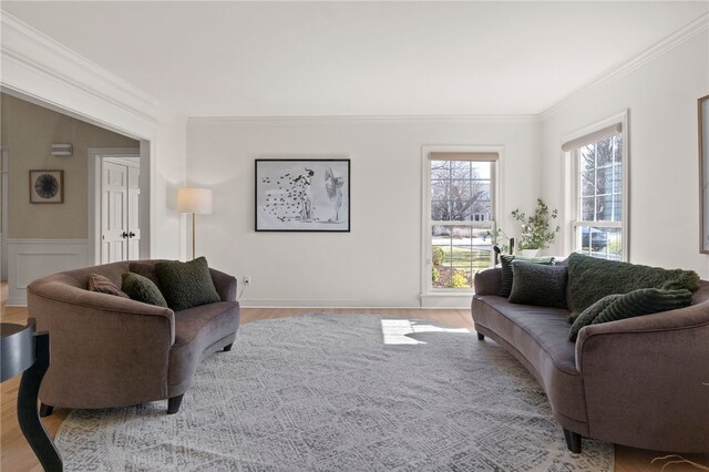 living area with wood finished floors and crown molding