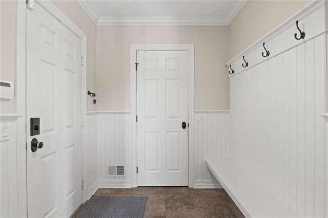 mudroom with visible vents, a wainscoted wall, and crown molding