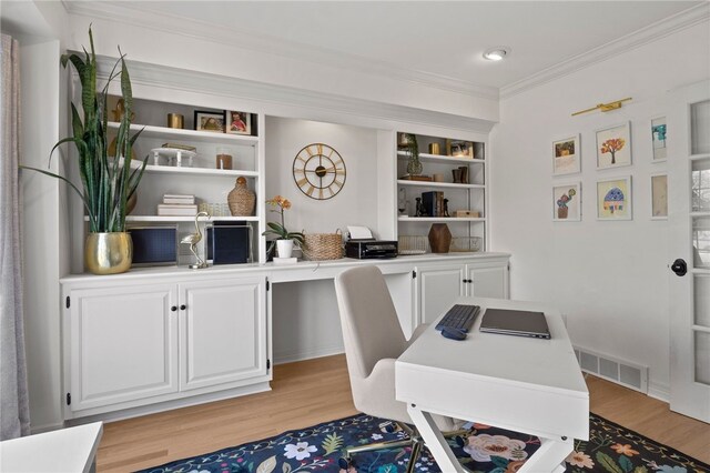 office area featuring ornamental molding, visible vents, recessed lighting, and light wood-style flooring
