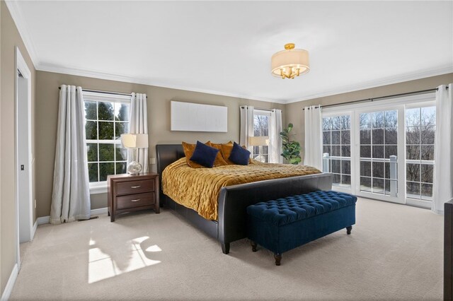 bedroom featuring crown molding, baseboards, and light carpet