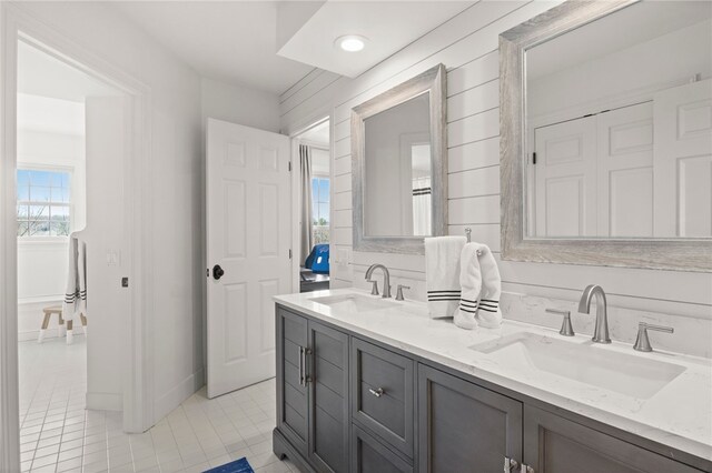 full bathroom with recessed lighting, tile patterned flooring, a sink, and double vanity