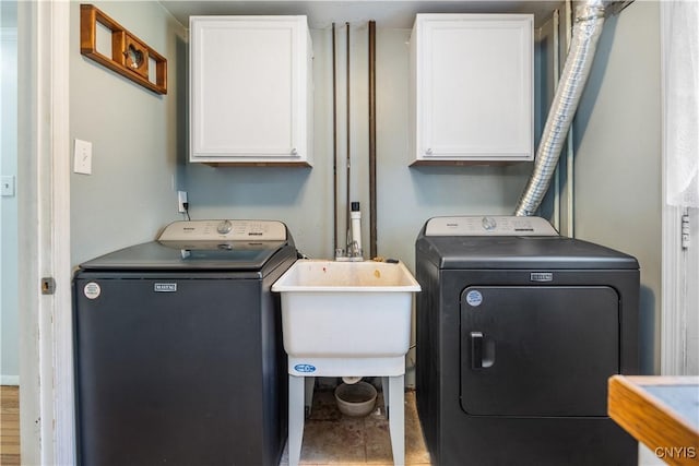 1905 Stump Rd, Skaneateles, NY 13108 - washroom featuring independent washer and dryer, cabinet space, and a sink