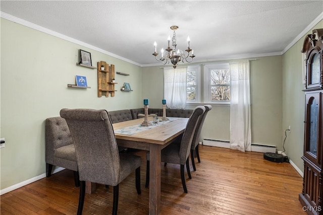 1905 Stump Rd, Skaneateles, NY 13108 - dining room featuring baseboards, wood-type flooring, ornamental molding, and a chandelier