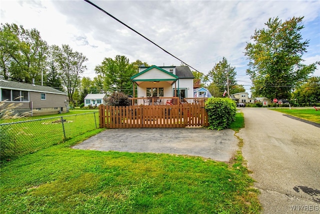 exterior space with fence and a yard