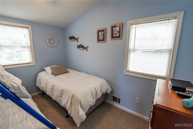 bedroom with baseboards, visible vents, carpet, and vaulted ceiling