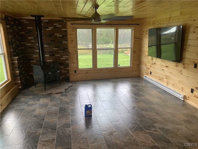 376 State Route 34, Hannibal, NY 13074 - interior space featuring wood ceiling, a ceiling fan, a wood stove, wood walls, and a baseboard heating unit