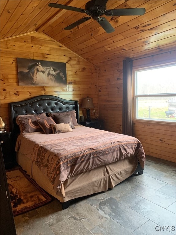 376 State Route 34, Hannibal, NY 13074 - bedroom featuring vaulted ceiling, wooden ceiling, wooden walls, a ceiling fan, and stone finish flooring