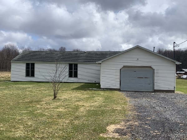 376 State Route 34, Hannibal, NY 13074 - exterior space featuring gravel driveway, a shingled roof, an attached garage, and a lawn