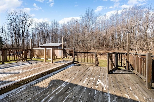 wooden deck with an outbuilding