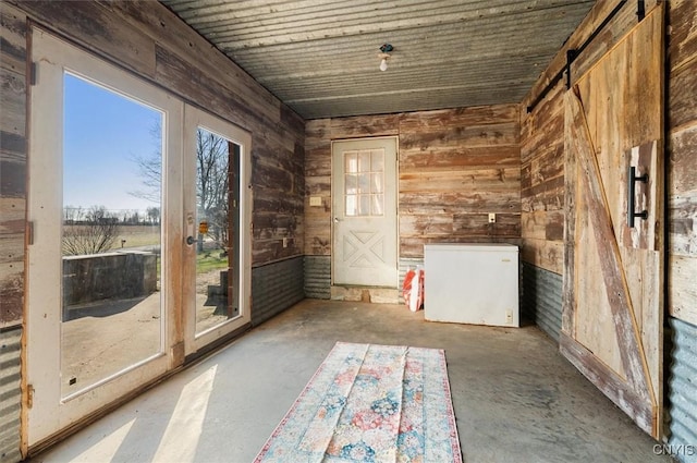 unfurnished sunroom with french doors