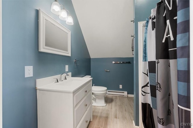 full bathroom with vanity, lofted ceiling, toilet, a baseboard radiator, and wood finished floors