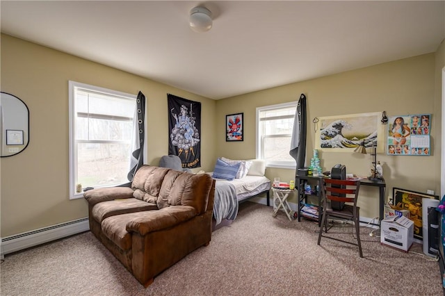 carpeted bedroom featuring a baseboard heating unit