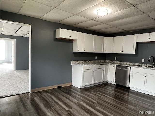 kitchen featuring dark wood-type flooring, white cabinets, a sink, and stainless steel dishwasher