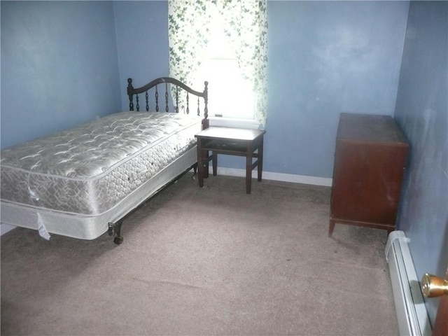 1268 County Road 19, Dix, NY 14812 - carpeted bedroom with a baseboard radiator and baseboards