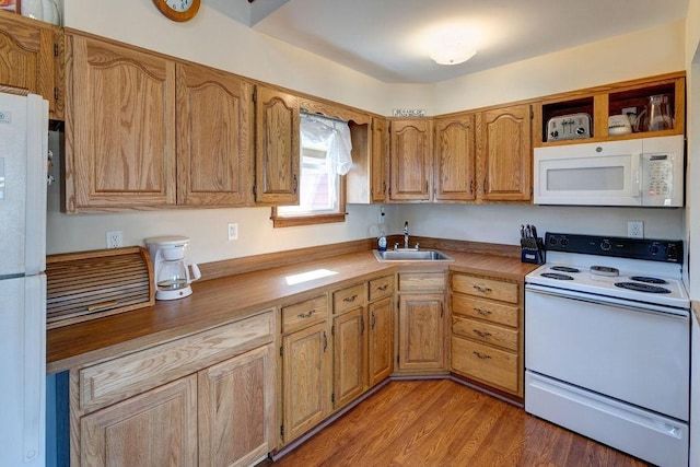 359 Squire Hill Rd, Roxbury, NY 12474 - kitchen featuring light countertops, white appliances, a sink, light wood-style floors, and brown cabinets