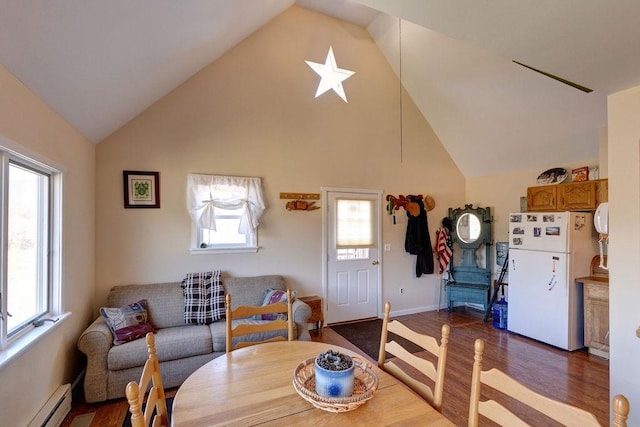359 Squire Hill Rd, Roxbury, NY 12474 - dining area featuring dark wood-style flooring, high vaulted ceiling, baseboards, and a baseboard heating unit