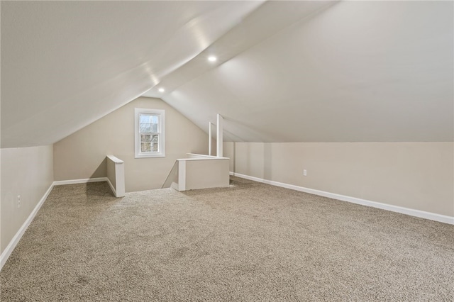 bonus room with carpet floors, baseboards, vaulted ceiling, and recessed lighting