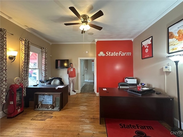 office space featuring ceiling fan, ornamental molding, and hardwood / wood-style flooring