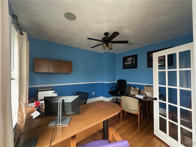home office featuring a ceiling fan and hardwood / wood-style floors