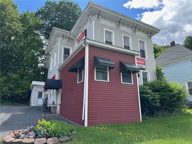 205 W Main St, German Flatts, NY 13357 - view of home's exterior featuring a lawn and driveway