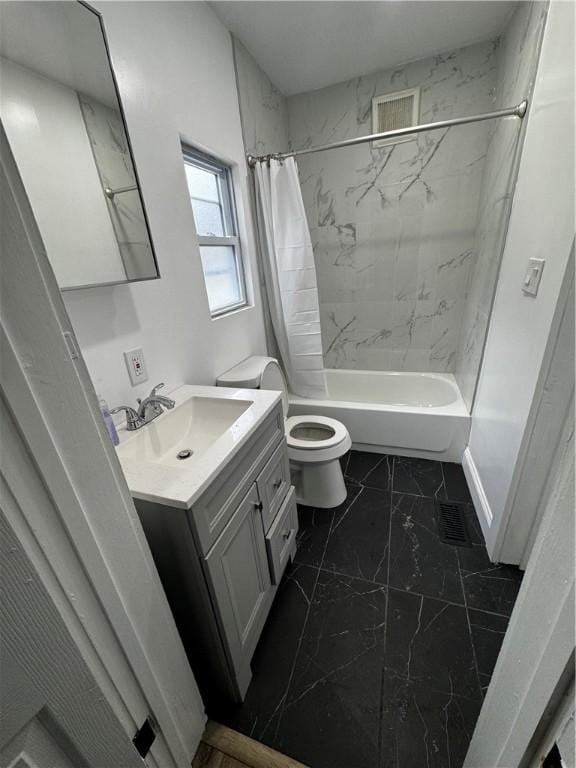 317 W State St, Albion, NY 14411 - bathroom featuring vanity, shower / bath combo, and marble look tile flooring