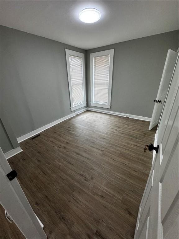 317 W State St, Albion, NY 14411 - empty room with dark wood-style floors