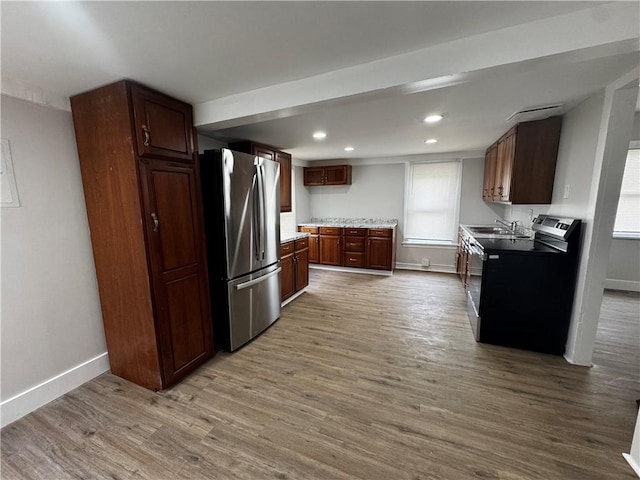 317 W State St, Albion, NY 14411 - kitchen featuring stainless steel appliances, wood finished floors, and recessed lighting
