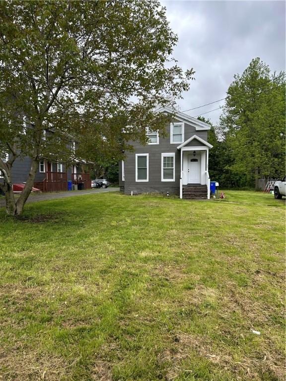317 W State St, Albion, NY 14411 - view of front of house featuring a front yard and entry steps