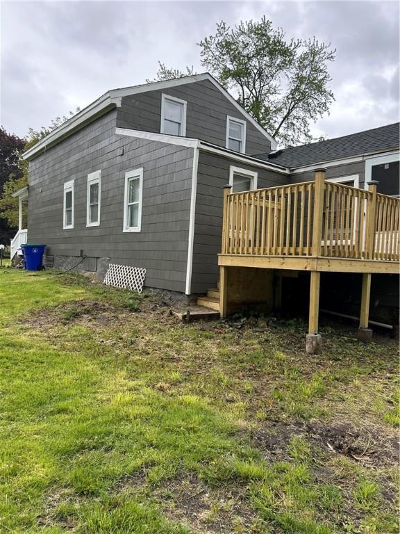 317 W State St, Albion, NY 14411 - back of property featuring a wooden deck and a lawn