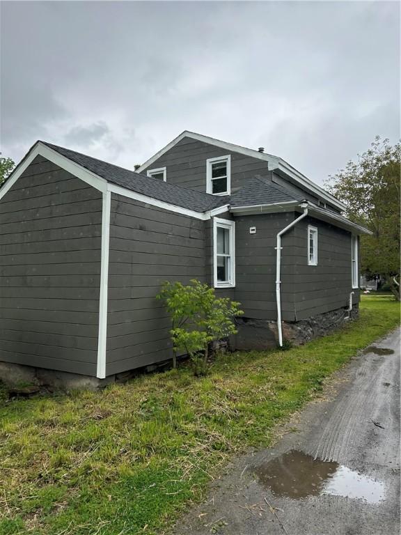 317 W State St, Albion, NY 14411 - view of side of home featuring a shingled roof