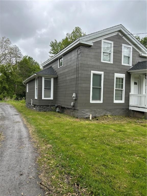 317 W State St, Albion, NY 14411 - view of side of home with a lawn