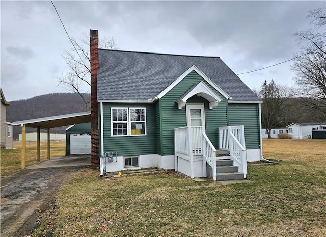 330 Victory Hwy, Erwin, NY 14870 - bungalow featuring a front lawn, driveway, a garage, and roof with shingles