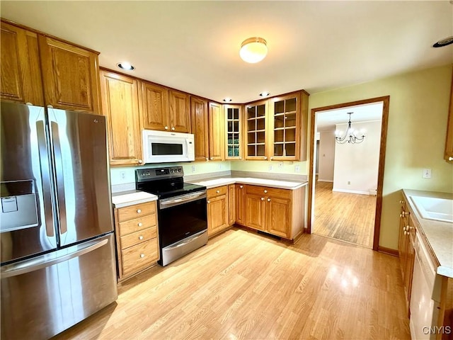 4062 Port St, Richland, NY 13142 - kitchen featuring appliances with stainless steel finishes, light countertops, light wood-type flooring, and recessed lighting