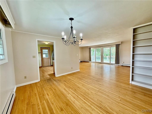 4062 Port St, Richland, NY 13142 - spare room with baseboard heating, a chandelier, light wood-style floors, a baseboard heating unit, and baseboards