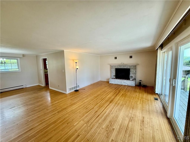 4062 Port St, Richland, NY 13142 - unfurnished living room with a baseboard heating unit, light wood-style floors, a fireplace with raised hearth, and baseboards