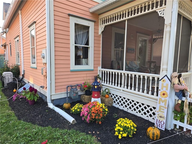view of side of property with a sunroom