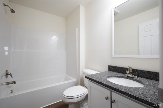 bathroom with shower / bath combination, toilet, and vanity