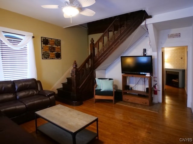 36 Lincoln Ave, Cortland, NY 13045 - living room with stairs, wood finished floors, and a ceiling fan