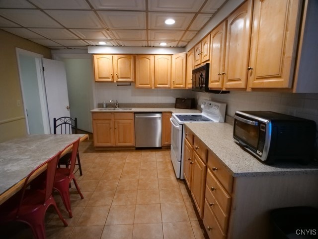 36 Lincoln Ave, Cortland, NY 13045 - kitchen featuring stainless steel dishwasher, a sink, light tile patterned flooring, white electric range, and black microwave