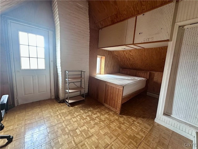 36 Lincoln Ave, Cortland, NY 13045 - unfurnished bedroom with wooden walls and vaulted ceiling