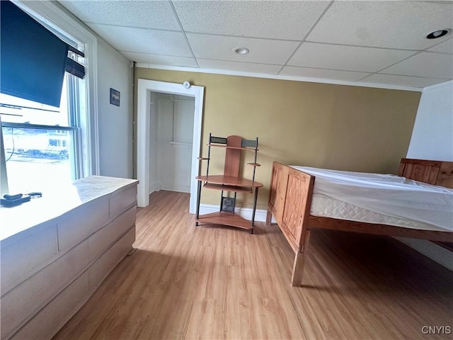 36 Lincoln Ave, Cortland, NY 13045 - bedroom featuring baseboards, a paneled ceiling, and light wood-type flooring