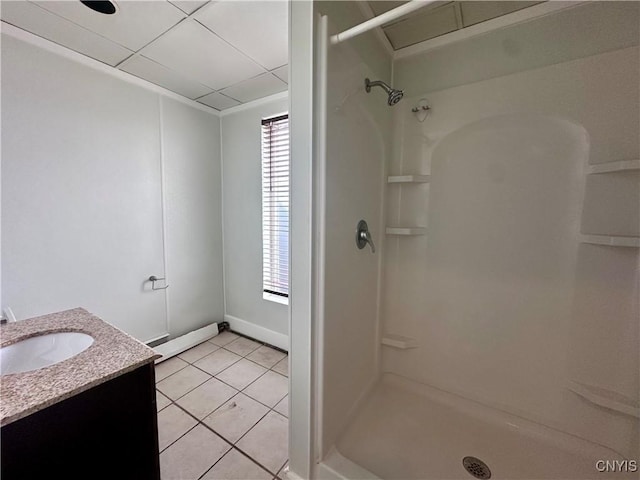 36 Lincoln Ave, Cortland, NY 13045 - full bathroom with a shower, tile patterned floors, vanity, baseboard heating, and a paneled ceiling