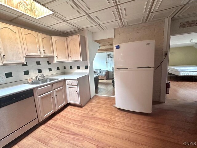 36 Lincoln Ave, Cortland, NY 13045 - kitchen with an ornate ceiling, a sink, dishwasher, freestanding refrigerator, and light wood-style flooring